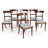 A SET OF SIX REGENCY STYLE MAHOGANY SIDE CHAIRS each plain curved top rail above a curved mid-