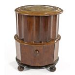 A VICTORIAN MAHOGANY CIRCULAR COMMODE the hinged circular top with a gilt-tooled leather-inset