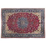 A KESHAN CARPET, PERSIA, MODERN the red field with a sky-blue floral star medallion, pale gold