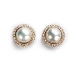 A PAIR OF MABE PEARL AND DIAMOND EARRINGS each centred with a mabe pearl measuring approximately