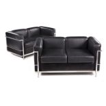 A PAIR OF REPRODUCTION LC2 LEATHER AND CHROMED TWO-SEATER SETTEES each padded back, seat and side