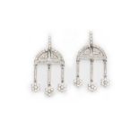 A PAIR OF DIAMOND PENDENT EARRINGS each of articulated geometric design, the semi-circular motif