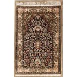 A QUM SILK PRAYER RUG, PERSIA, MODERN the black mehrab with two ascending flowering trees and