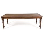 A CAPE STINKWOOD AND YELLOWWOOD TEN-SEATER DINING TABLE, 19TH CENTURY the rounded rectangular top