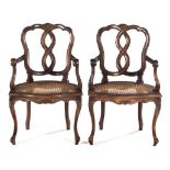 A PAIR OF FRENCH STYLE FRUITWOOD ARMCHAIRS each shaped and scrolled top rail surmounted by a