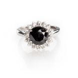 A DIAMOND RING centred with a circular-cut black diamond weighing 2.4800cts, enclosed within a