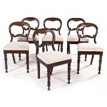 A SET OF SIX MAHOGANY BUSTLE BACK CHAIRS, 19TH CENTURY each curved top rail above a scrolling mid-