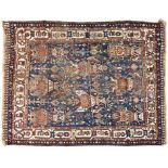 A SHIRAZ RUG, SOUTH WEST PERSIA, CIRCA 1950 the blue field with an overall design of stylised