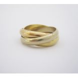 AN 18CT GOLD 'TRINITY DE CARTIER' RING in rose, white and yellow gold, French mark for 18ct, size