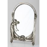 AN ART NOUVEAU EASEL BACK MIRROR of oval form, with ribbed column frame applied with a barefoot