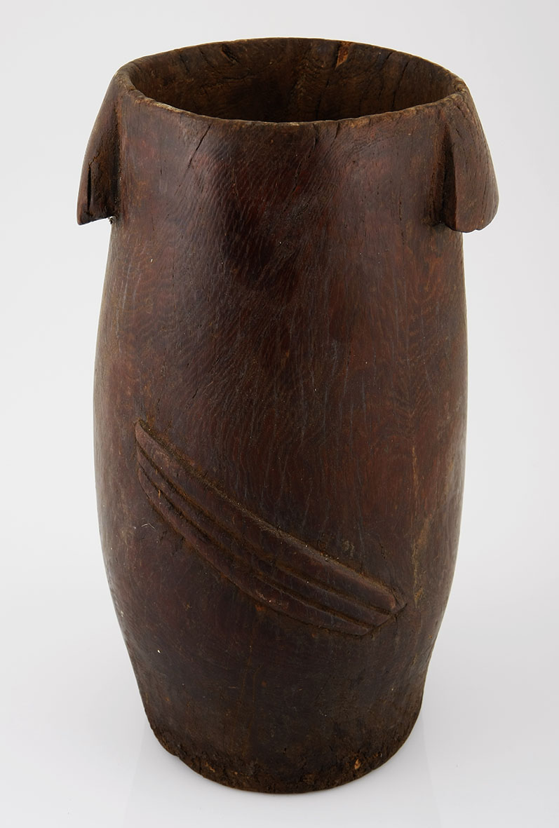 A ZULU MILK PAIL, SOUTH AFRICA of typical form, carved handles, the body with carved decorations