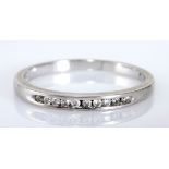 A DIAMOND HALF-ETERNITY RING channel-set with brilliant-cut diamonds weighing approximately 0.