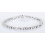 A DIAMOND TENNIS BRACELET claw-set with brilliant-cut diamonds weighing approximately 3.5cts in