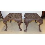 A PAIR OF CAST-IRON GARDEN SIDE TABLES each moulded rectangular pierced foliate top on hipped legs