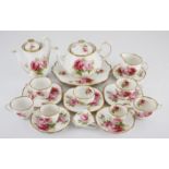 A ROYAL ALBERT 'AMERICAN BEAUTY' PART TEA AND COFFEE SERVICE, 1941 - 1990 each printed with sprays