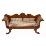 A MINIATURE COLONIAL TEAK AND CANED SETTEE the scrolled carved and curved back with caned sides