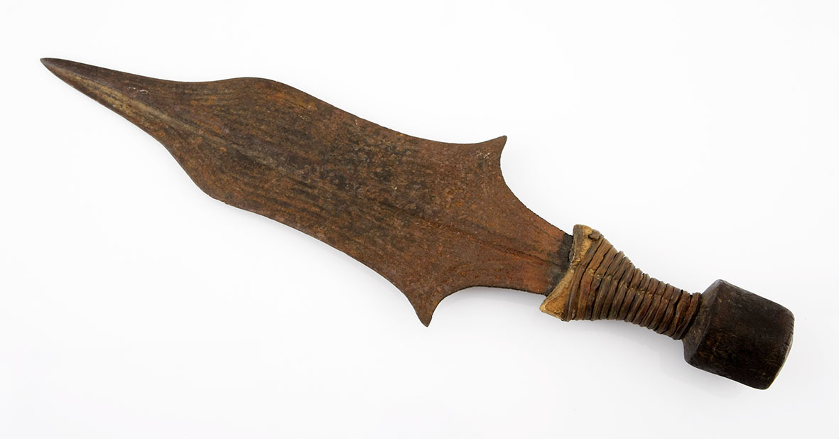 A KUBA KNIFE, DEMOCRATIC REPUBLIC OF CONGO a shaped blade with copper bound wooden handle 42,5cm