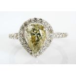 A DIAMOND RING centered with a pear-shaped diamond weighing approximately 2.43cts, the conforming