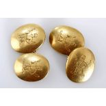 A PAIR OF 18CT GOLD CUFFLINKS each with two oval shaped forms, engraved with a man blowing a horn,