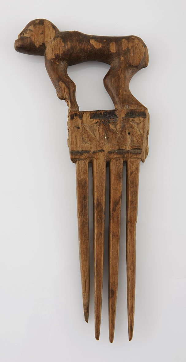 A CHOKWE COMB, ANGOLA the handle carved in the form of a baboon 20cm long