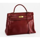 A VINTAGE HERMES KELLY HANDBAG rouge box calf leather with gold metal hardware, missing lock 35cm