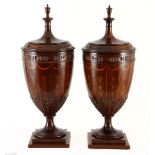 A PAIR OF EDWARDIAN MAHOGANY AND INLAID URNS each moulded detachable cover surmounted by an urn-