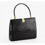 A VINTAGE CROCODILE SKIN HANDBAG NOT SUITABLE FOR EXPORT black glossy leather with gold metal