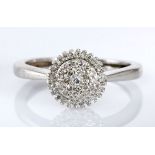 A DIAMOND CLUSTER RING pave-set with brilliant-cut diamonds weighing approximately 0.50cts in total,