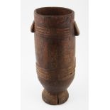 A ZULU MILK PAIL, SOUTH AFRICA of typical form, carved handles, the sides decorated with carved