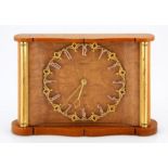 A WALNUT AND BRASS DESK CLOCK, JAEGER-LECOULTRE the 11,5cm brass circular dial with Arabic numeral