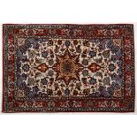 AN ISPAHAN RUG, PERSIA, MODERN the ivory field with a floral madder star medallion, sky blue