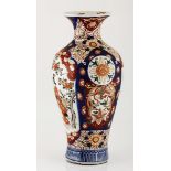 A JAPANESE IMARI VASE, MEIJI, 1868 - 1912 the baluster body painted with shaped panels enclosing a