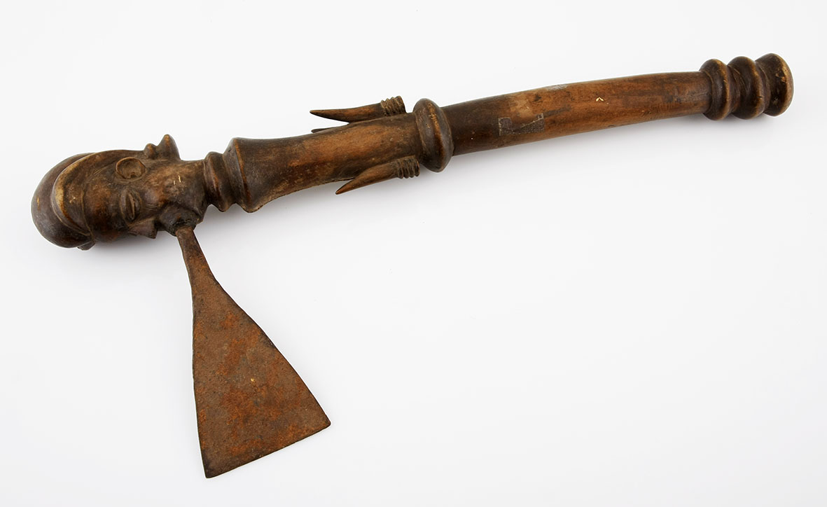 A CHOKWE AXE, ANGOLA the shaft with duiker horns and surmounted by a carved male mask 43cm long