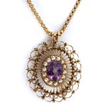 AN AMETHYST AND SEED PEARL PENDANT/BROOCH centred with an oval mixed-cut amethyst weighing