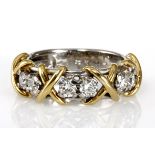 A DIAMOND RING, SCHWARTZ the reeded band, claw-set with six brilliant-cut diamonds weighing