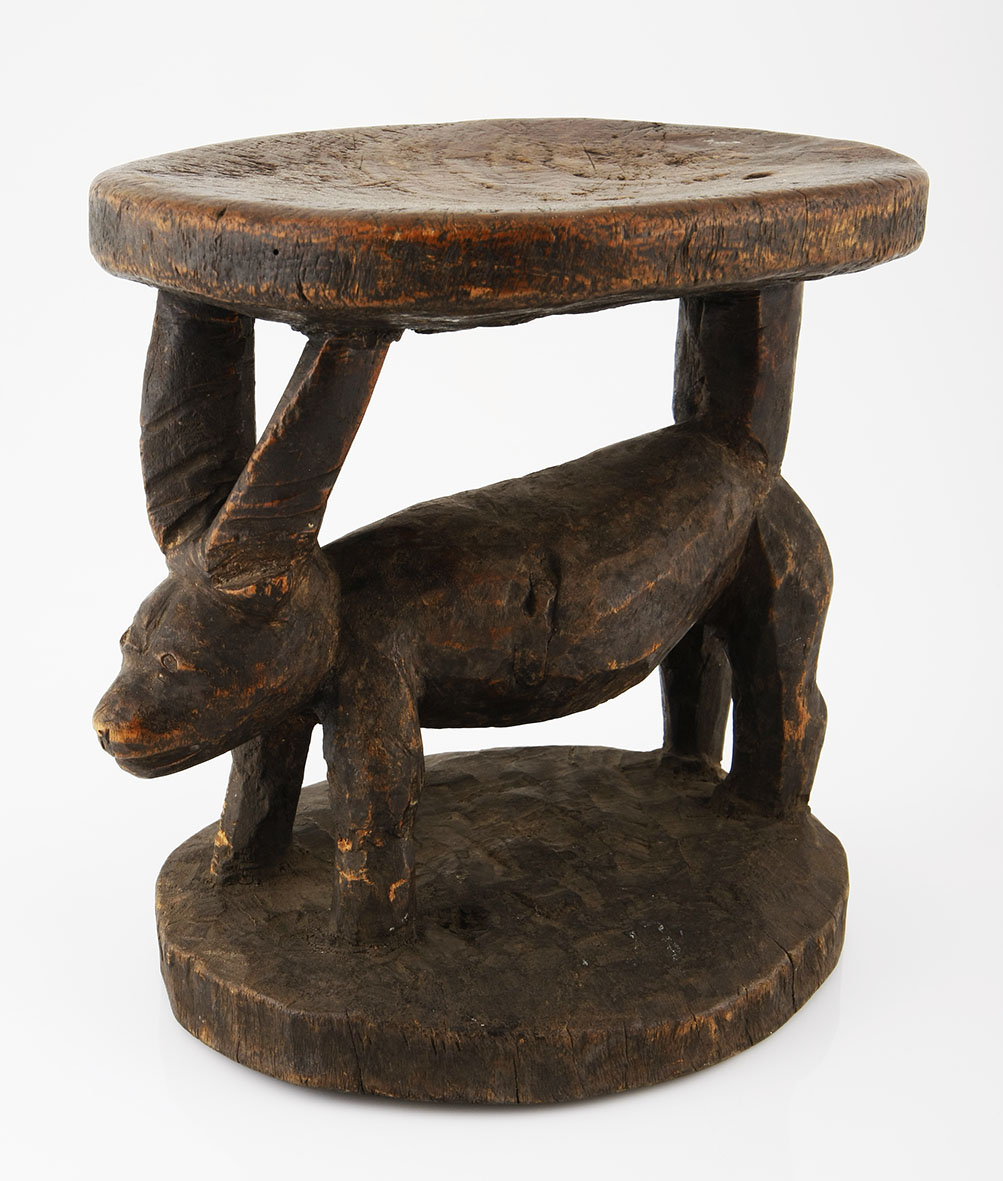 A PENDE STOOL, DEMOCRATIC REPUBLIC OF CONGO modeled with as a carved antelope 27.5cm high