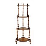 A VICTORIAN ROSEWOOD CORNER WHAT-NOT each triangular shaped shelf with an inlaid urn motif, on