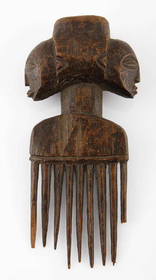A LUBA COMB, DEMOCRATIC REPUBLIC OF CONGO the handle carved as Janus female mask 16cm long