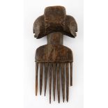 A LUBA COMB, DEMOCRATIC REPUBLIC OF CONGO the handle carved as Janus female mask 16cm long