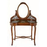 A FRENCH WALNUT AND CANE DRESSING TABLE MANUFACTURED BY ALEXANDRE HUGNET, PARIS, LATE 19TH/EARLY