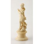 A FRENCH CARVED IVORY FIGURE 'FEMME AVEC DES COLOMBES', LATE 19TH CENTURY NOT SUITABLE FOR EXPORT