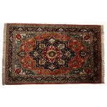 A TABRIZ SILK RUG, NORTH WEST, PERSIA MODERN the red field with a stylised dark indigo blue and