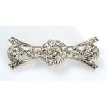 A DIAMOND BROOCH the open-work plaque set with three brilliant-cut diamonds weighing approximately