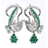 A PAIR OF DIAMOND AND TSAVORITE EARRINGS each designed as a foliate cluster, claw-set with pear- and