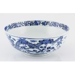 A CHINESE BLUE AND WHITE BOWL, KANGXI, 1662 – 1722 the interior depicting a bird perched amongst
