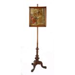 A VICTORIAN WALNUT AND TAPESTRY ADJUSTABLE FIRESCREEN the rectangular tapestry within a moulded