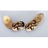 A PAIR OF 9CT ROSE GOLD CUFFLINKS each with two oval shaped forms, one engraved with a monogram, the