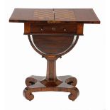 A REGENCY ROSEWOOD GAMES TABLE the hinged rectangular top swivelling to reveal a compartment
