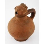 A TERRACOTTA VESSEL, DEMOCRATIC REPUBLIC OF CONGO the spout in the form of a human head, the ovoid