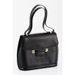 A BALLY LEATHER HANDBAG the rounded off square shape in black leather with gold hardware, adjustable